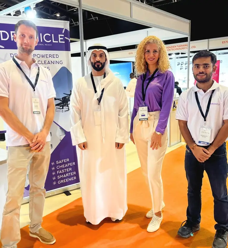 Photo of DRONICLE's team next to the DCAA representative.