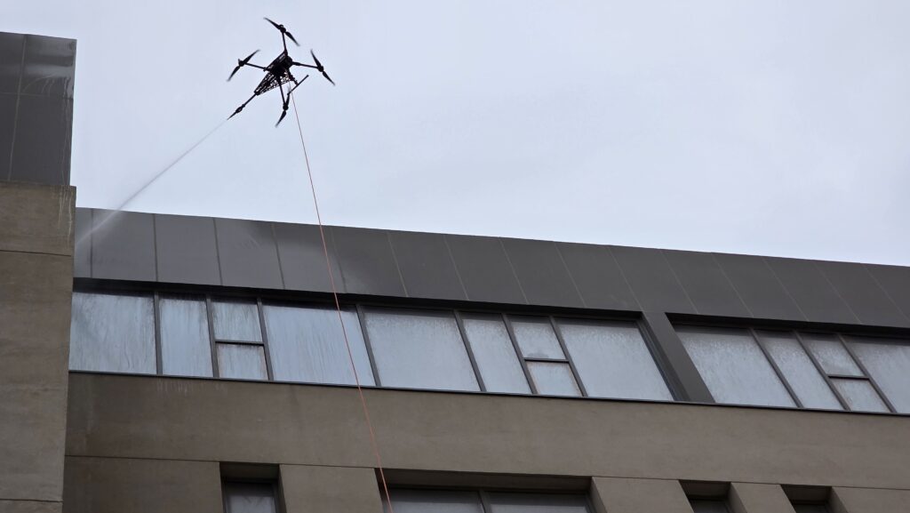 Professional drone window cleaning service in Dubai by DRONICLE for schools and commercial buildings